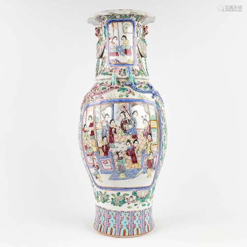 A Chinese vase decorated with relief dragons and phoenixes, ...