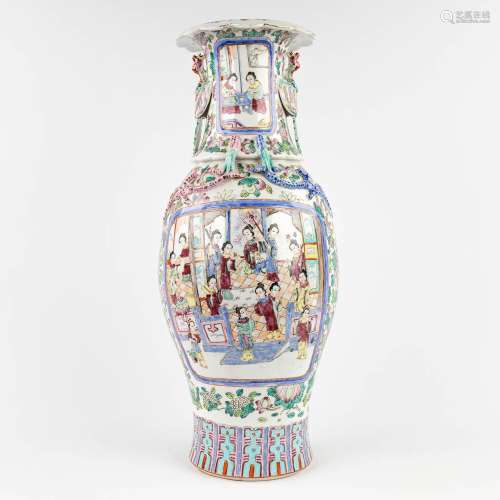 A Chinese vase decorated with relief dragons and phoenixes, ...