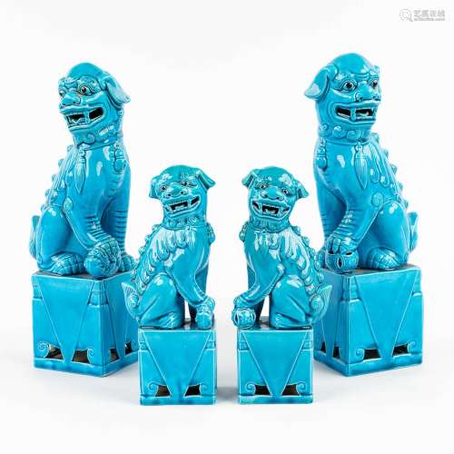 A collection of 2 pairs of Foo dogs, made of blue glazed cer...