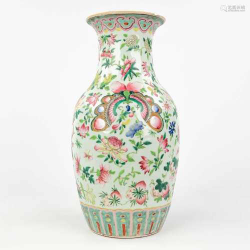 A Famille Rose Chinese vase with a hand-painted decor of flo...