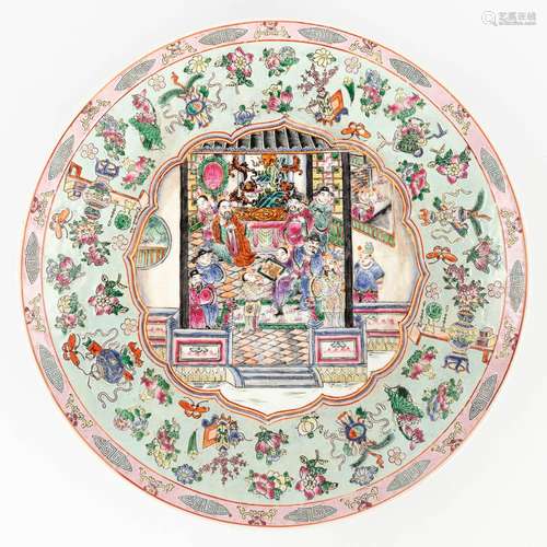 A large Chinese plate Famille Rose and decorated with warrio...