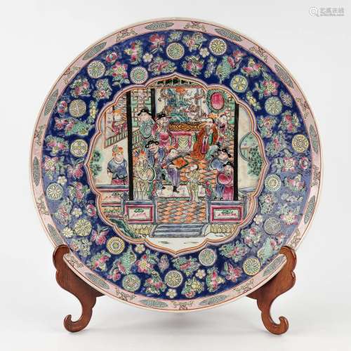 A large Chinese plate 'Famille Rose', decorated with the emp...