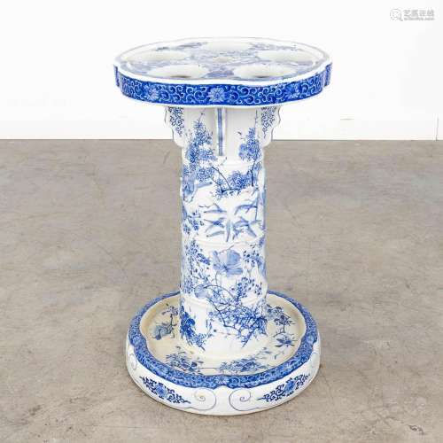 A Chinese porcelain umbrella stand, blue white stoneware dec...