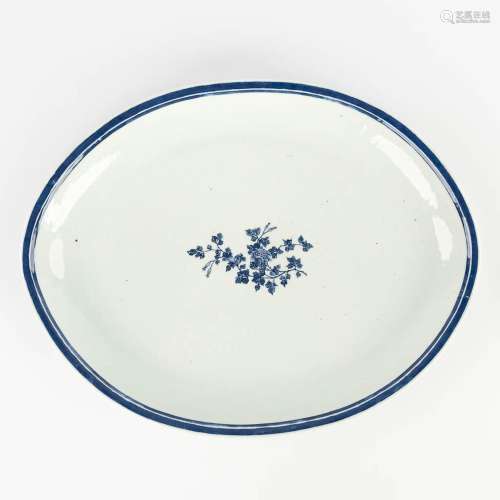 A large Chinese serving plate with blue-white flower decor. ...