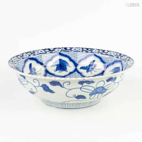 A large Japanese bowl, blue-white porcelain decorated with c...