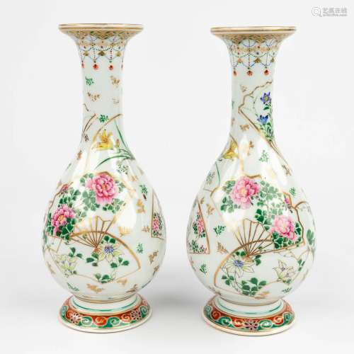 A pair of Oriental vases with floral decor and butterflies. ...