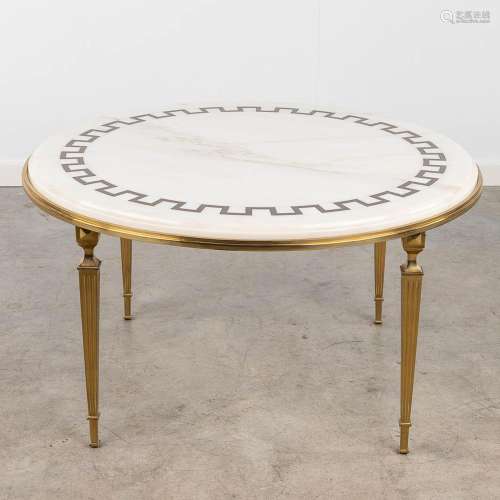 A mid-century coffee table, brass and marble. Hollywood Rege...