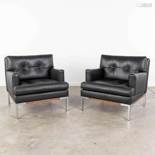 A pair of black leather, mid-century sofas. Circa 1970. (L: ...