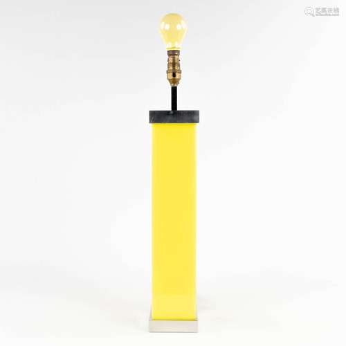 A vintage table lamp, aluminium and yellow acrylic, circa 19...