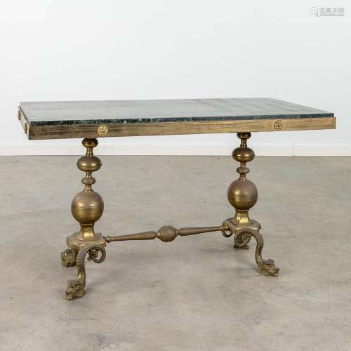 A mid-century coffee table made of bronze with a green marbl...