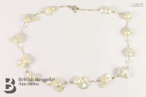 Fabulous baroque pearl necklace. The necklace set with thirt...