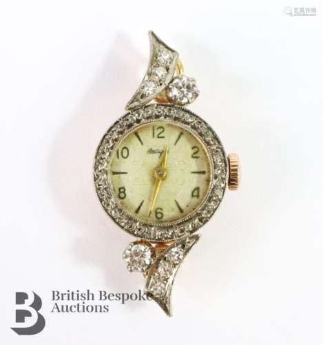 14ct white gold and diamond cocktail watch. The watch having...