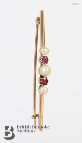 14ct pearl and ruby bar brooch. The brooch set with central ...