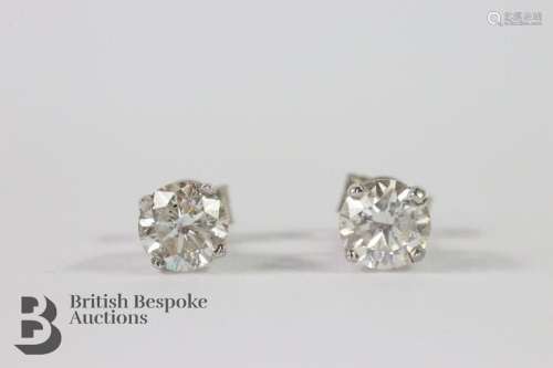 Pair of 14ct white gold diamond stud earrings