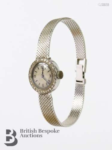 A vintage 18ct gold and diamond dress watch. The watch havin...