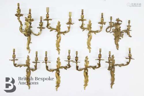 Eight ornate style gilt metal wall light fittings