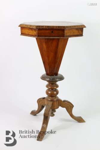 Victorian walnut-veneer octagonal sewing table. The table ha...