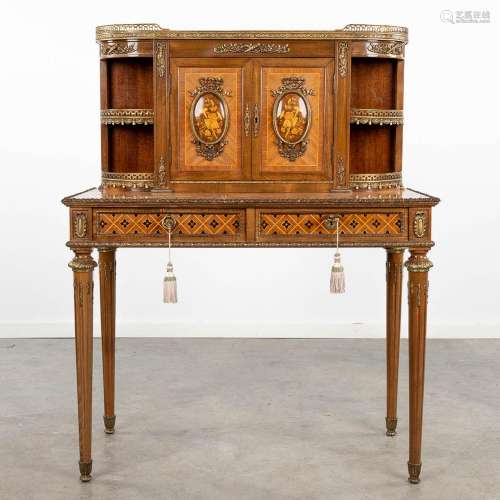 A lady's desk finished with marquetry inlay and mounted with...