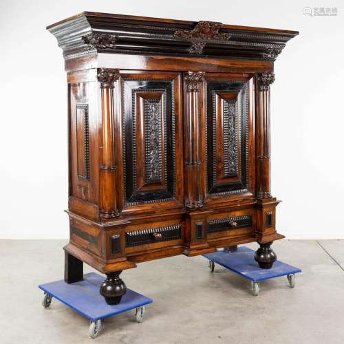 A Dutch pillow cabinet, finished with angel wood sculptures,...