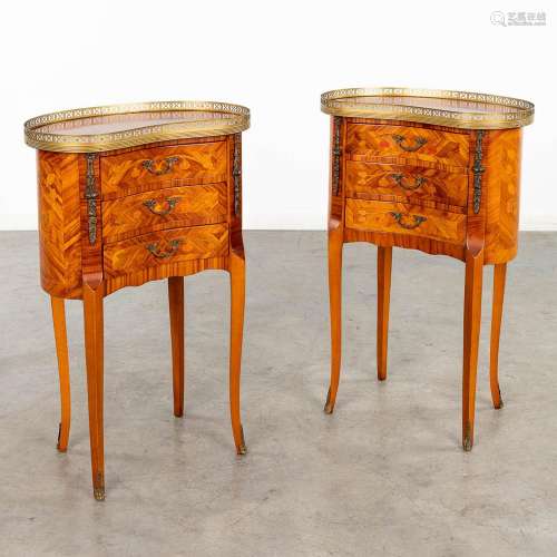 A pair of kidney-shaped side tables, decorated with marquetr...