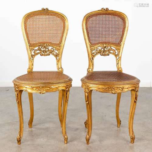 A pair of gilt chairs, sculptured wood in Louis XVI style. C...