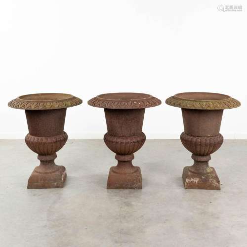 A collection of 3 large garden vases made of cast iron. (H: ...