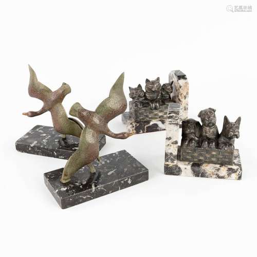 A set of 2 pairs of book-ends with flying ducks, marked Bron...