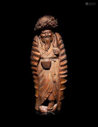 A Japanese Carved Bamboo Figure of an Elderly