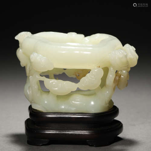 A Chinese Carved White Jade Washer