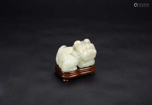 Late Qing - A White Jade Carved Lion (woodstand)