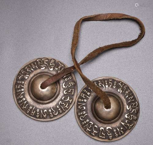 A TIBETAN BRASS CYMBAL, CHINA, 20TH CENTURY