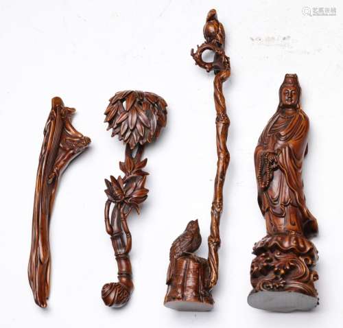 A GROUP OF WOODEN CARVING OBJECTS