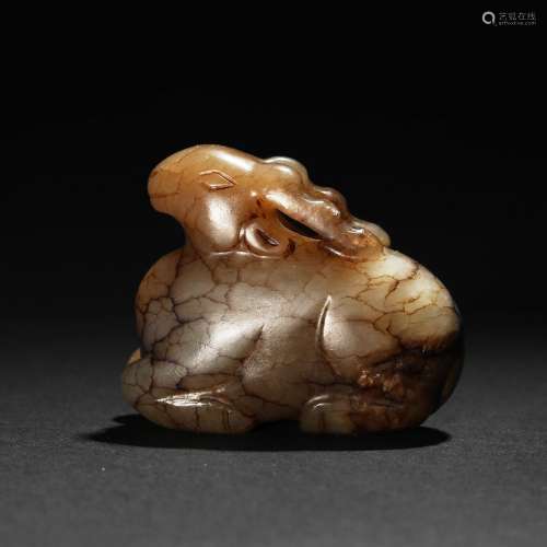 A BROWN JADE MYTHICAL BEAST CARVING