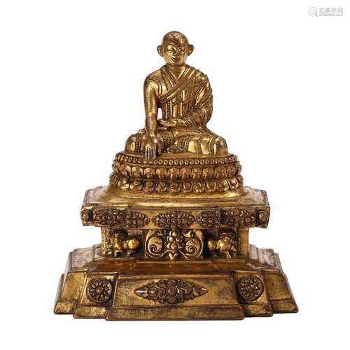 A GILT-BRONZE FIGURE OF GURU