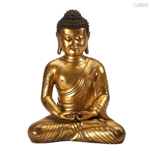 A GILT-BRONZE FIGURE OF SEATED SHAKYAMUNI