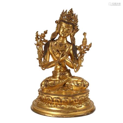 A GILT-BRONZE FIGURE OF A SEATED TARA