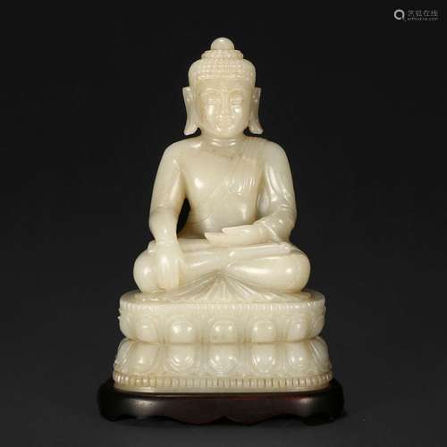 A WHITE JADE SHAKYAMUNI FIGURE