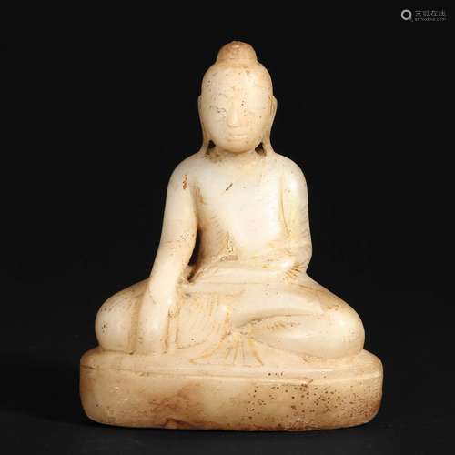 A WHITE JADE SHAKYAMUNI FIGURE