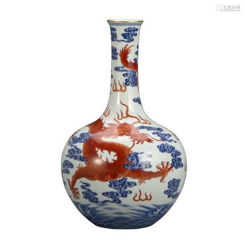 A BLUE AND WHITE AND COPPER RED 'DRAGON' BOTTLE VASE