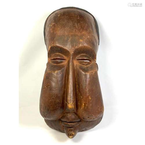 VINTAGE CARVED WOOD MASK. ELONGATED FACE. SLITS FOR EYES AND...