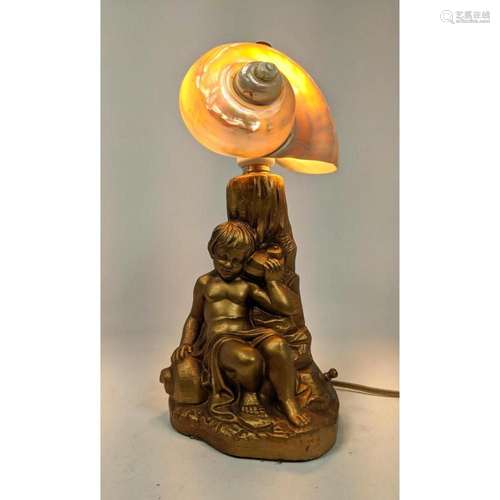 NAUTILUS SHELL SHADE FIGURAL METAL LAMP. YOUNG BOY HOLDS SHE...