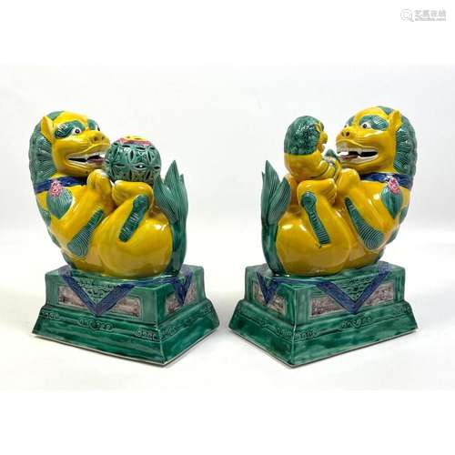 PR POLYCHROME GLAZED CERAMIC FIGURAL LIONS. ONE LION HOLDS B...