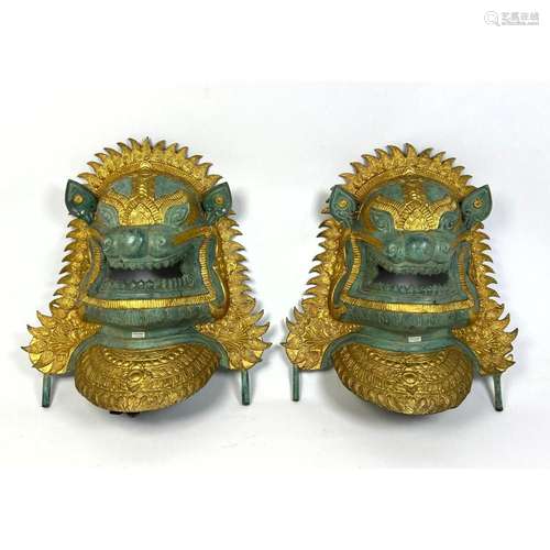 PAIR METAL TIBETAN LION MASK PLAQUES. 3 DIMENSIONAL. GILT.