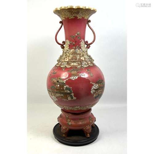 PORCELAIN HANDLED VASE. URN. RICHLY DECORATED. FIGURAL FEET....