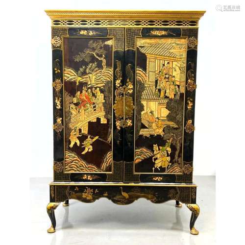 EBONIZED ASIAN SCENIC TWO DOOR CABINET. ORNATE BRASS HINGES....