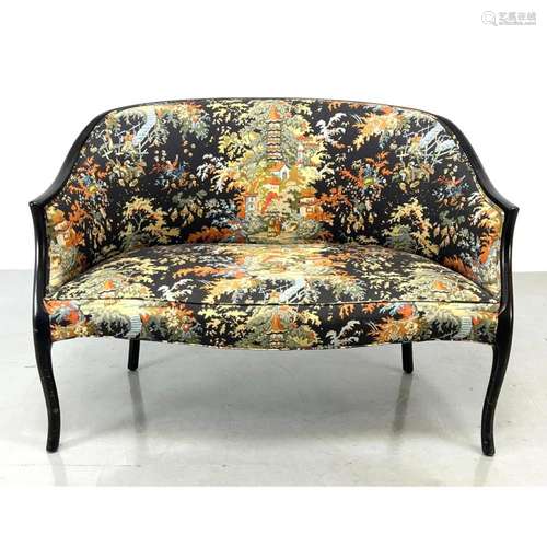 EBONIZED FRAME FLORAL UPHOLSTERED LOVE SEAT.