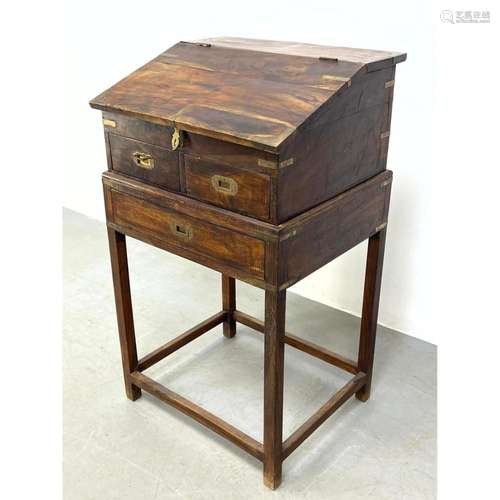 LIFT TOP CAMPAIGN STYLE DESK. STAND. BRASS TRIM AND INSET PU...