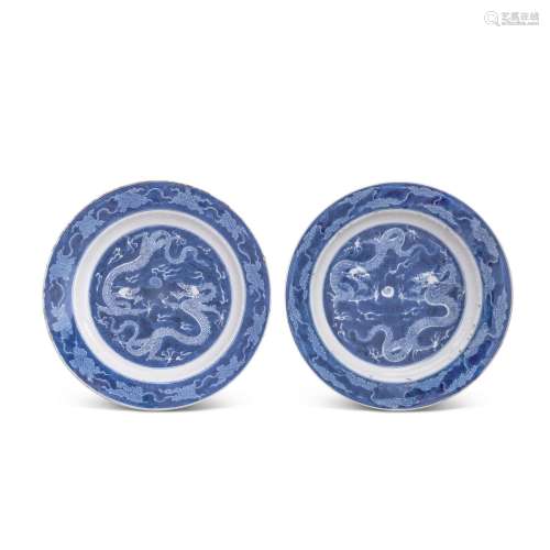 A pair of blue and white 'dragon' dishes, Qing dynas...