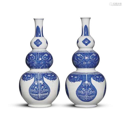 A pair of blue and white triple-gourd 'taotie' vases...