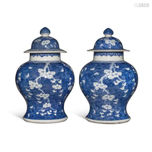 A pair of blue and white 'prunus' baluster jars and ...